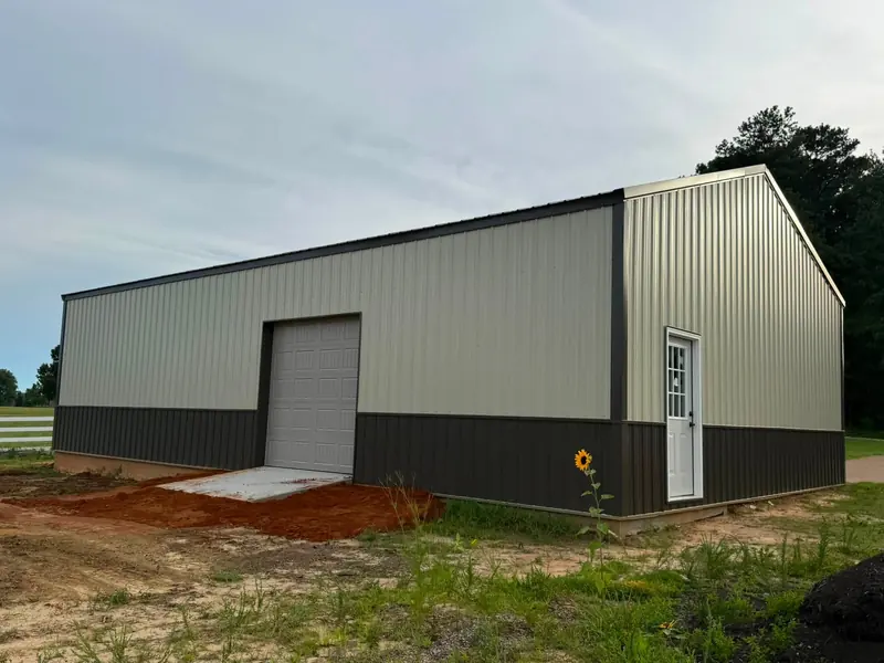 Metal pole shop with overhead door and walk door